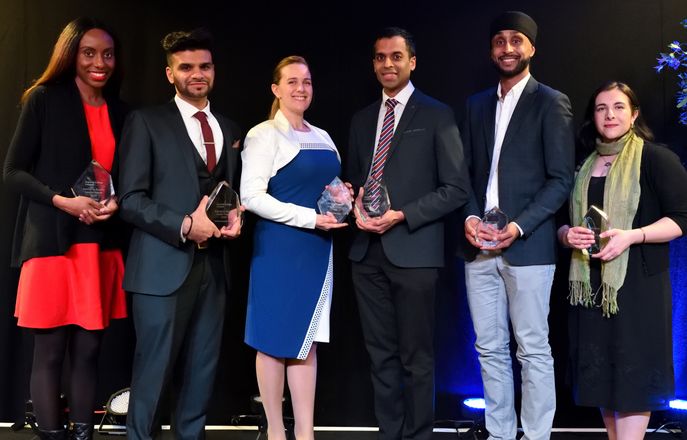 Emerging Alumni Leader Award winners on stage