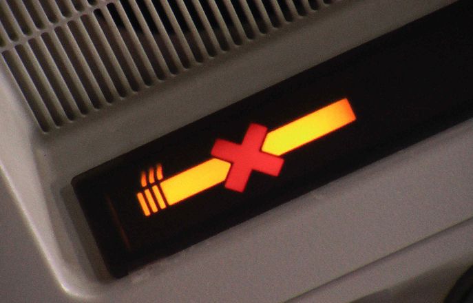 No smoking sign on an airplane
