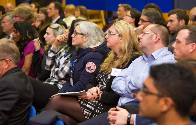 Photo of the attendees of 2016's annual networking event listening to a speaker.