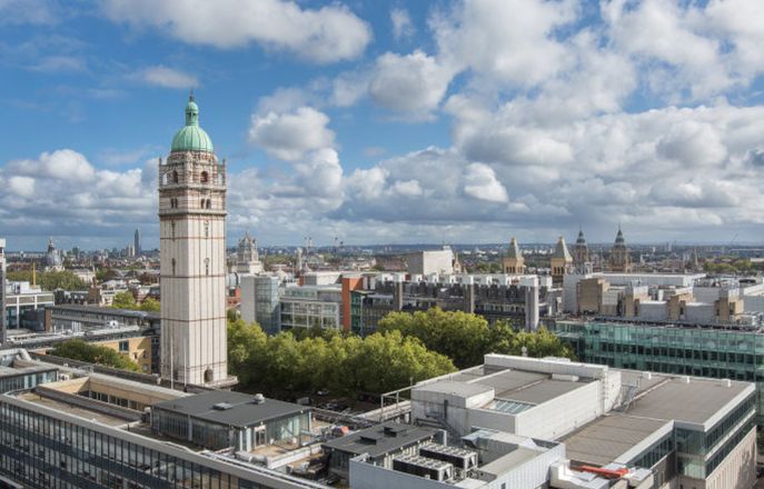 Aerial image of the South Kensington Campus with the Queen's tower on the left hand side and white clouds on a blue sky