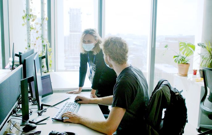 Two colleagues working together in an office