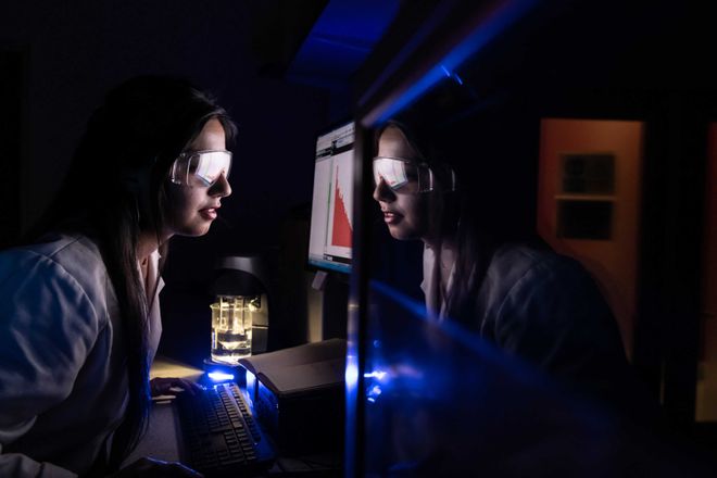 A PhD student working in the lab