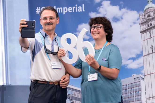 Milestone alumni take a selfie in the Alumni Lounge at Alumni Weekend