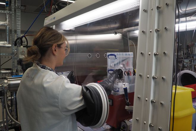 Daisy Thornton working in the glovebox