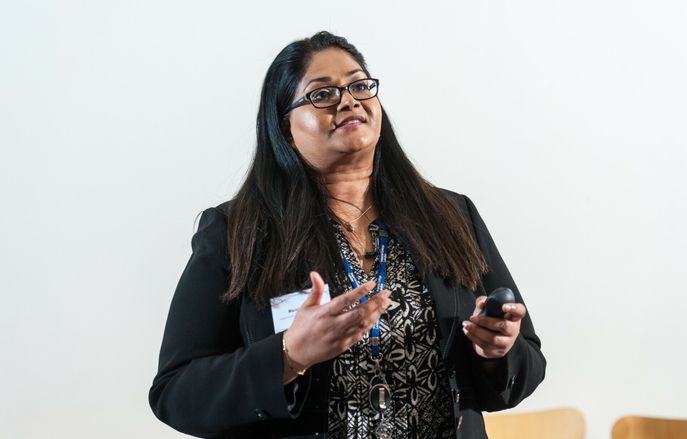 Female staff member presenting in a lecture
