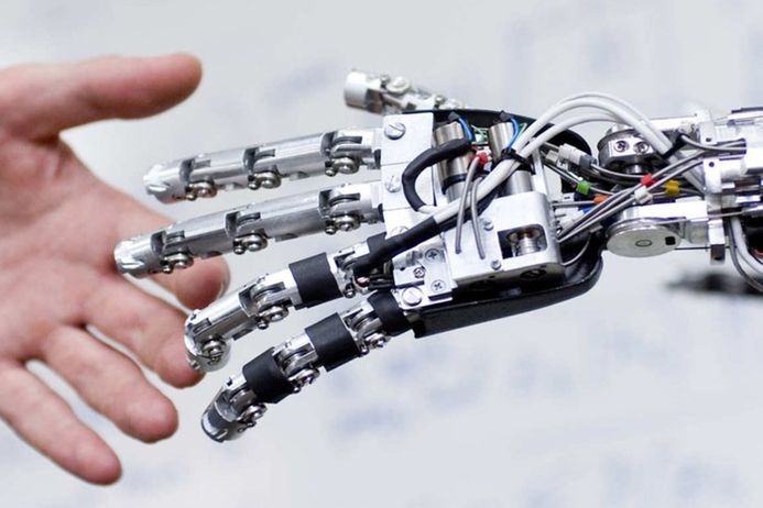 Robot and human hands touching