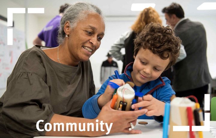 Community woman and child at community event in the invention rooms cafe