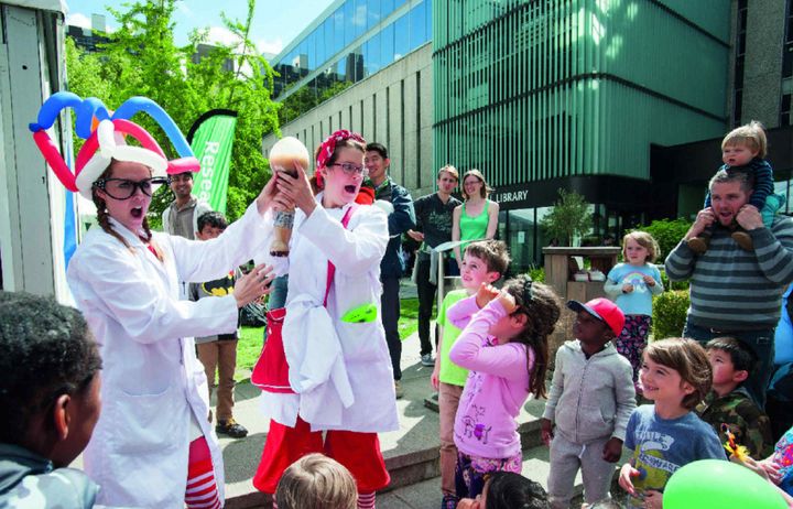 Children being entertained by a science presentation at Imperial