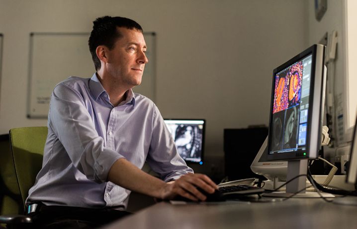 Dr Declan O'Regan with heart image displayed on computer screen