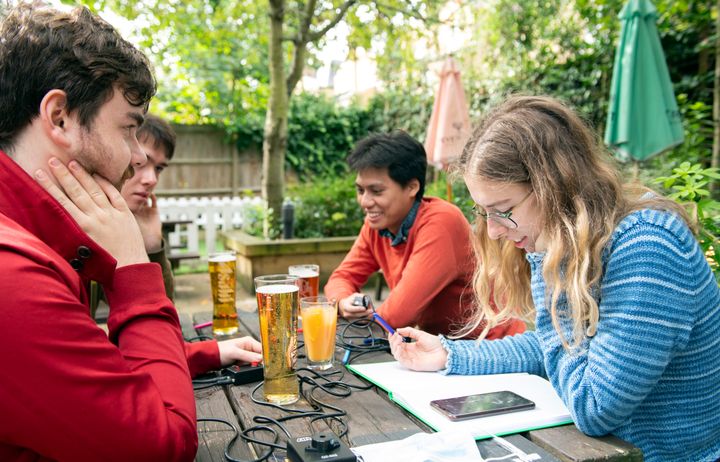 Students sitting outside practising as part of Imperial's Quiz Society