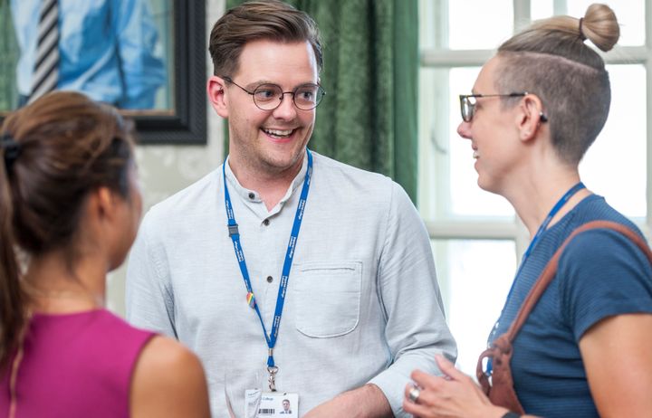 Staff talking at an EDI training event