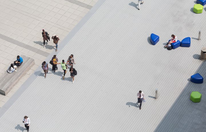 People walking across Dalby Court in South Kensington