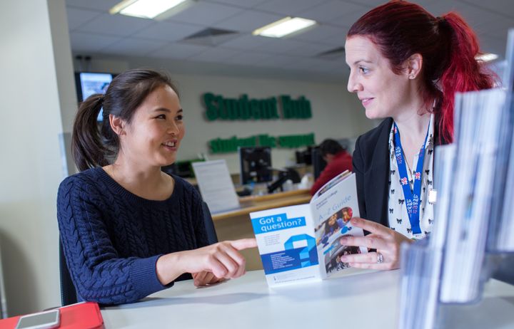 Student receiving advice in student hub