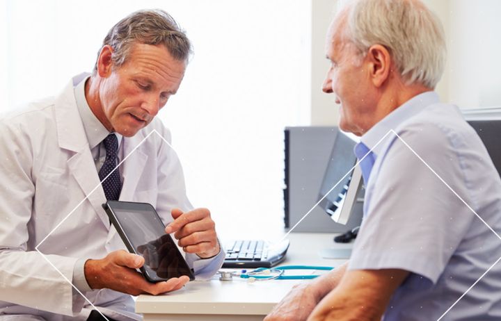 Senior patient talking with male doctor