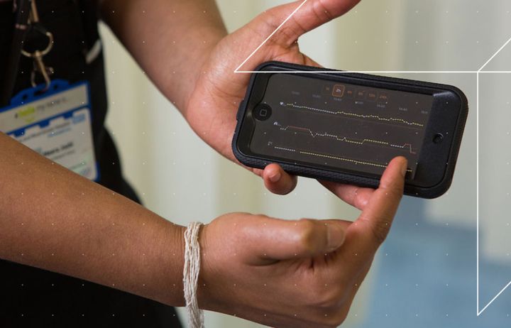 Doctor showing medical data on a smartphone