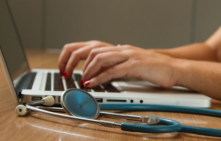 Doctor using a laptop