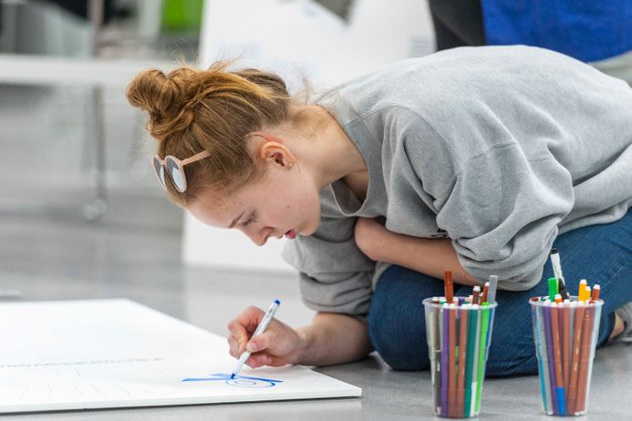 Student drawing on paper