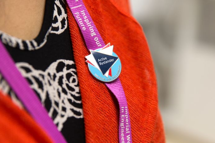 A person wearing an Active Bystander badge
