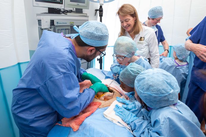 doctor teaching children in operation