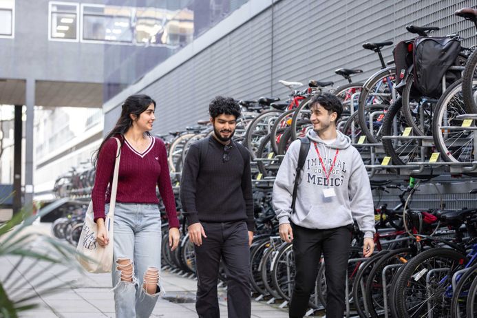 Undergraduate medical students walking next to bike racks near the Faculty Building