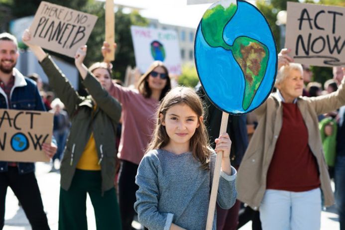 People holding climate change placards