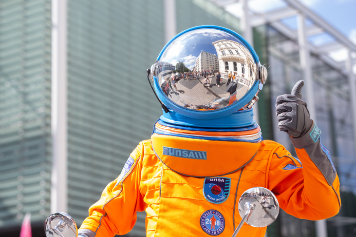 A person in an astronaut's suit at the festival