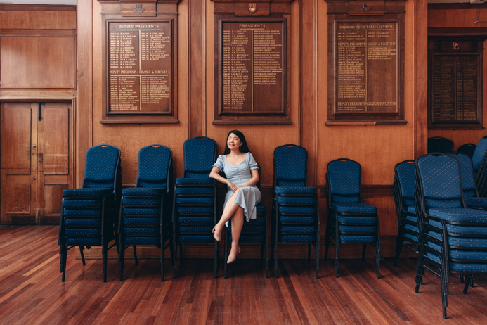 Hayley Wong sitting in the dining room in the Union