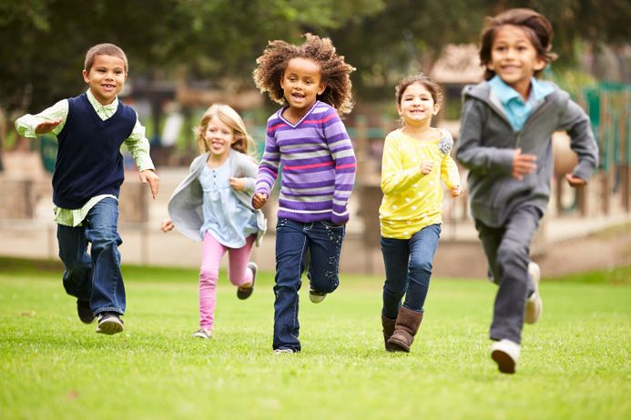 A picture of children playfully running