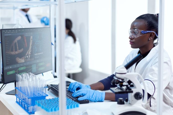 A picture of a researcher testing in a clinical trial