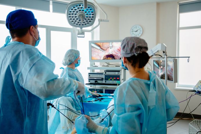 A picture of surgeons operating on a patient