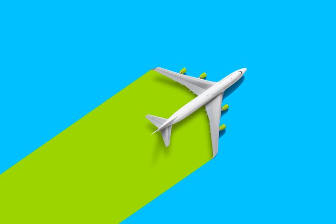 An illustration of a plane against a green and blue background