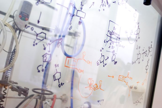 Reaction pathways written on a fume cupboard