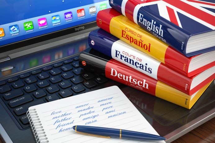 Different language books on a laptop