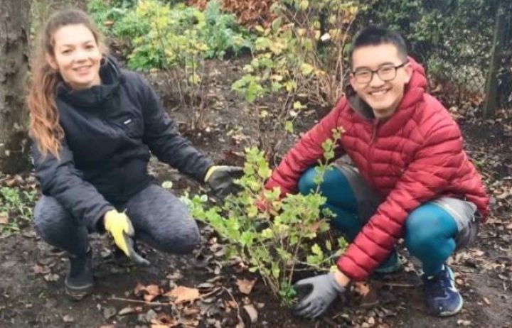 Two students with some plants