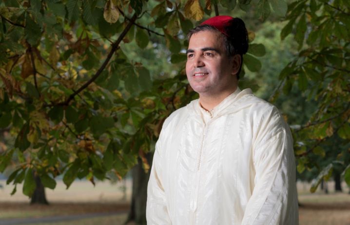Professor Amin Hajitou wearing a djellaba in a London park