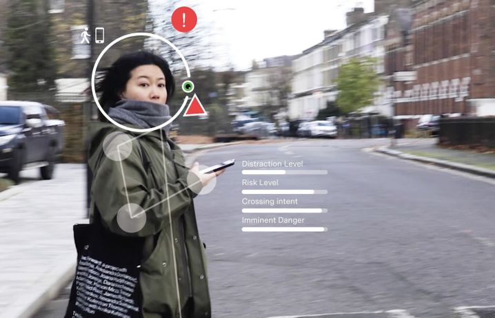 Image of pedestrian with overlay showing metrics like 'distraction level' and 'crossing intent'
