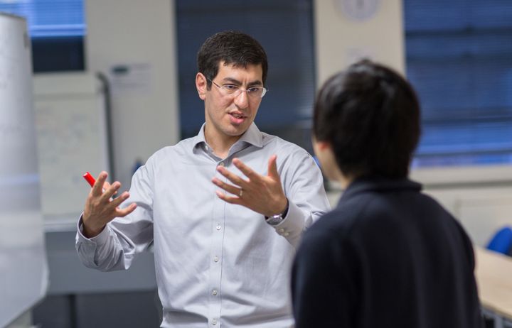 An academic talking to a student