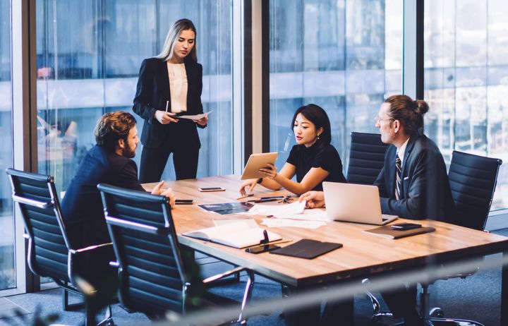 Four people in a work meeting