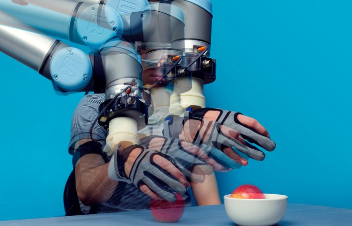Soft robotic glove interface enabling a person to lift an apple from a table to a bowl