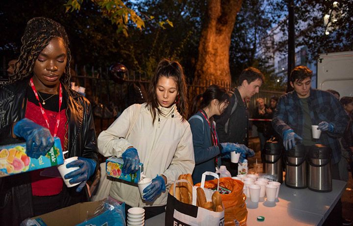 Members of the Soup Run Society serving drinks outside Lincoln's Inn Fields in London