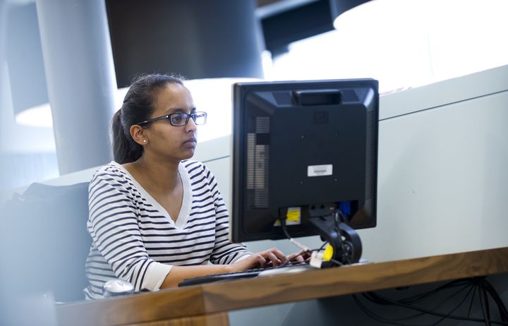 A woman working at a computer