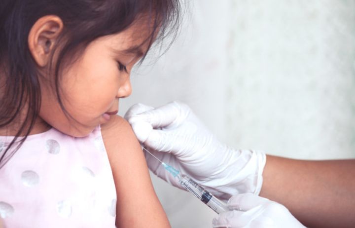 Child receiving an injection