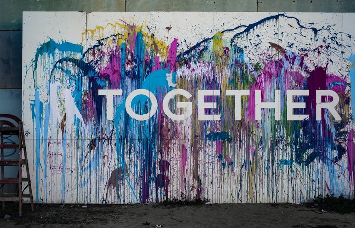 together graffiti on wall