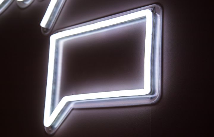 neon sign in shape of chat box