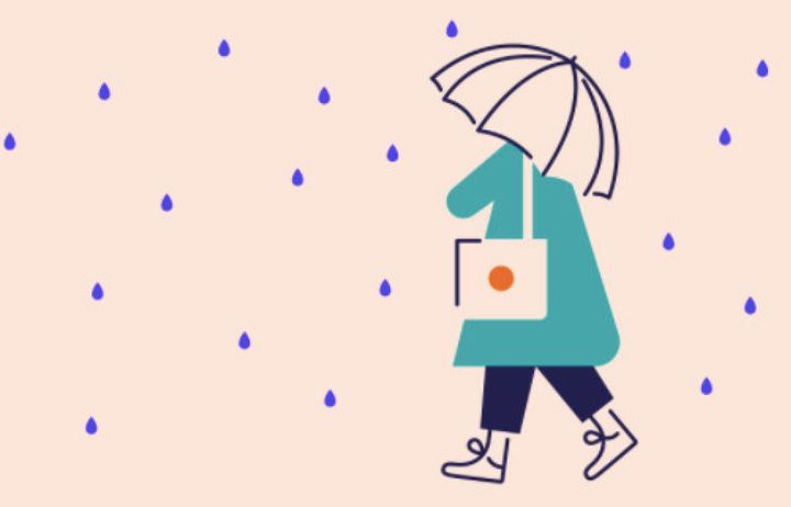 lady walking in rain with umbrella