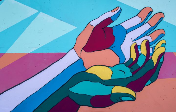 painting of two arms and hands next to each other