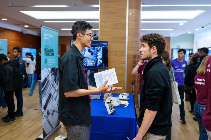 Two students talking at an event at Imperial's South Kensington Campus