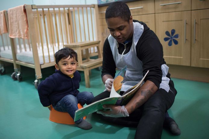 A toddler with caregiver