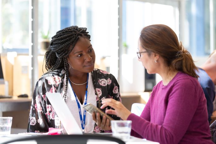 Two women having a discuss at What The Tech