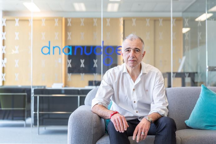 A guy from DnaNudge sitting on a chair